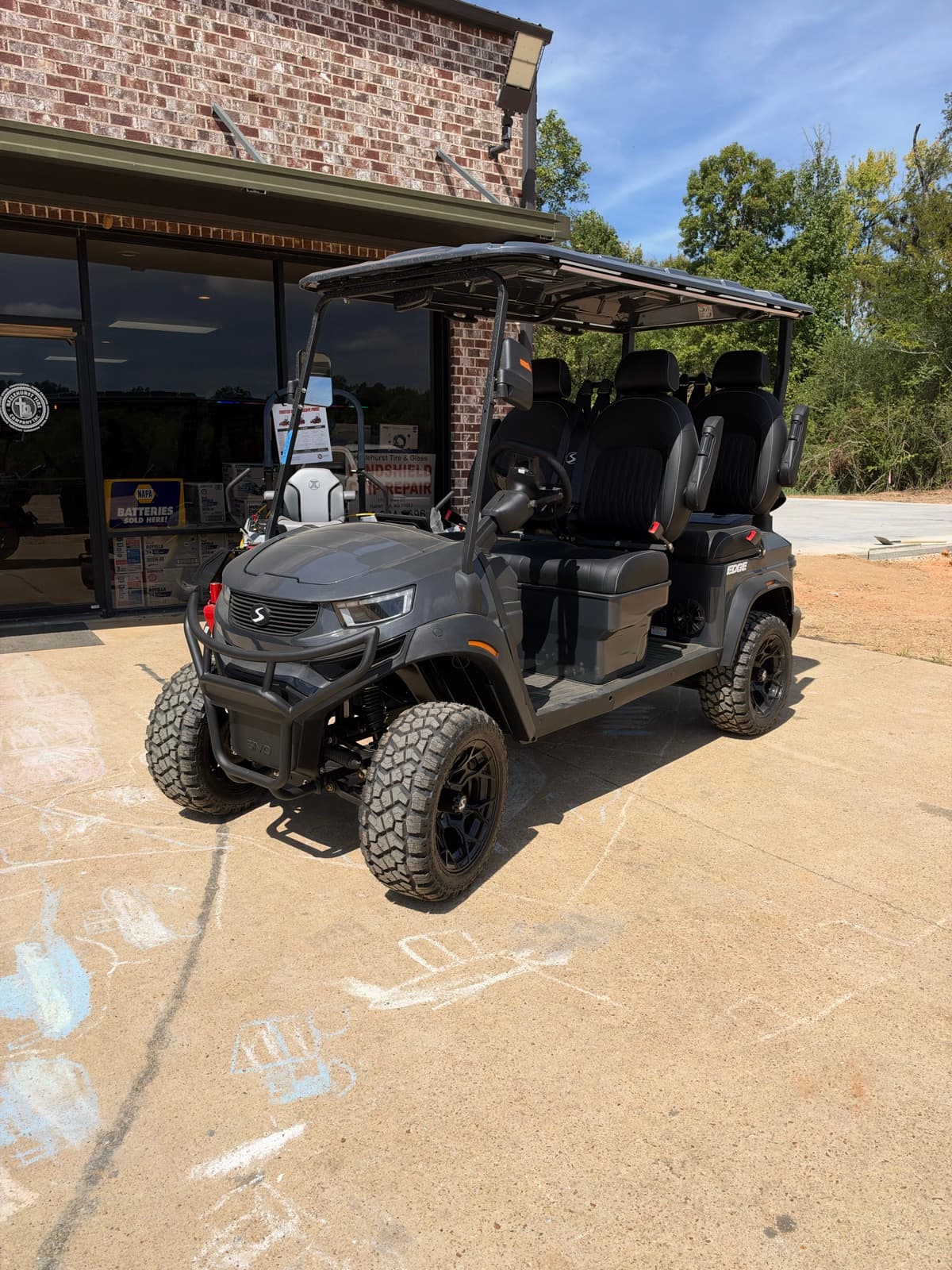 Charcoal lifted SIVO Edge 4-passenger golf cart at Hazlehurst Tire Company