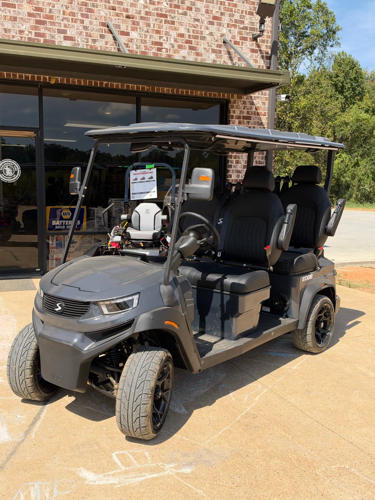 Gray SIVO Edge 4-passenger golf cart with street tires at Hazlehurst Tire Company