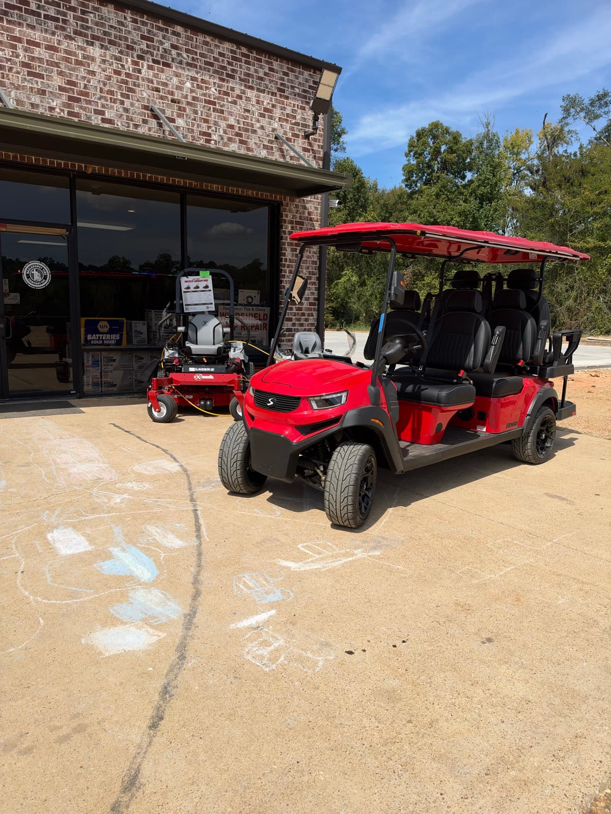 Red SIVO Edge 6-passenger golf cart on the lot at Hazlehurst Tire Company in Hazlehurst, MS
