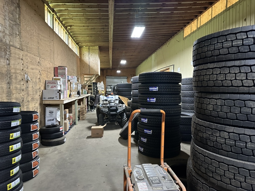 Stacks of new tires inside Hazlehurst Tire Company